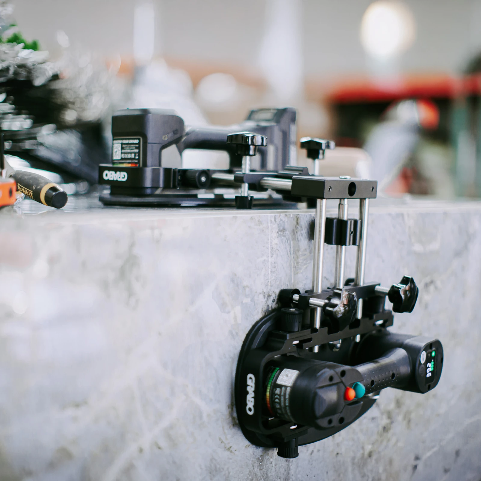 GRABO 90 Degree Seam Setter V2 clamped to a concrete worktop