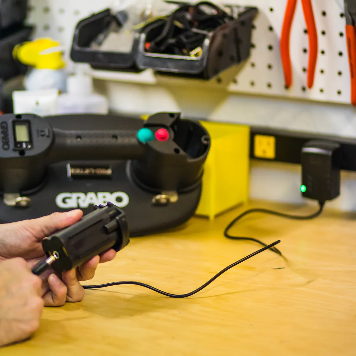 GRABO® battery charging on a workshop bench