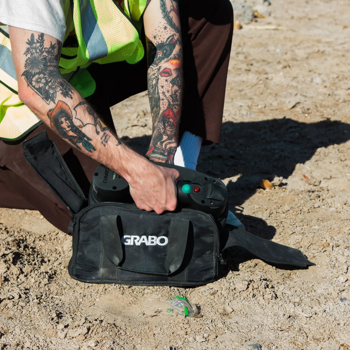 Worker packing a GRABO® lifter into the bag on site